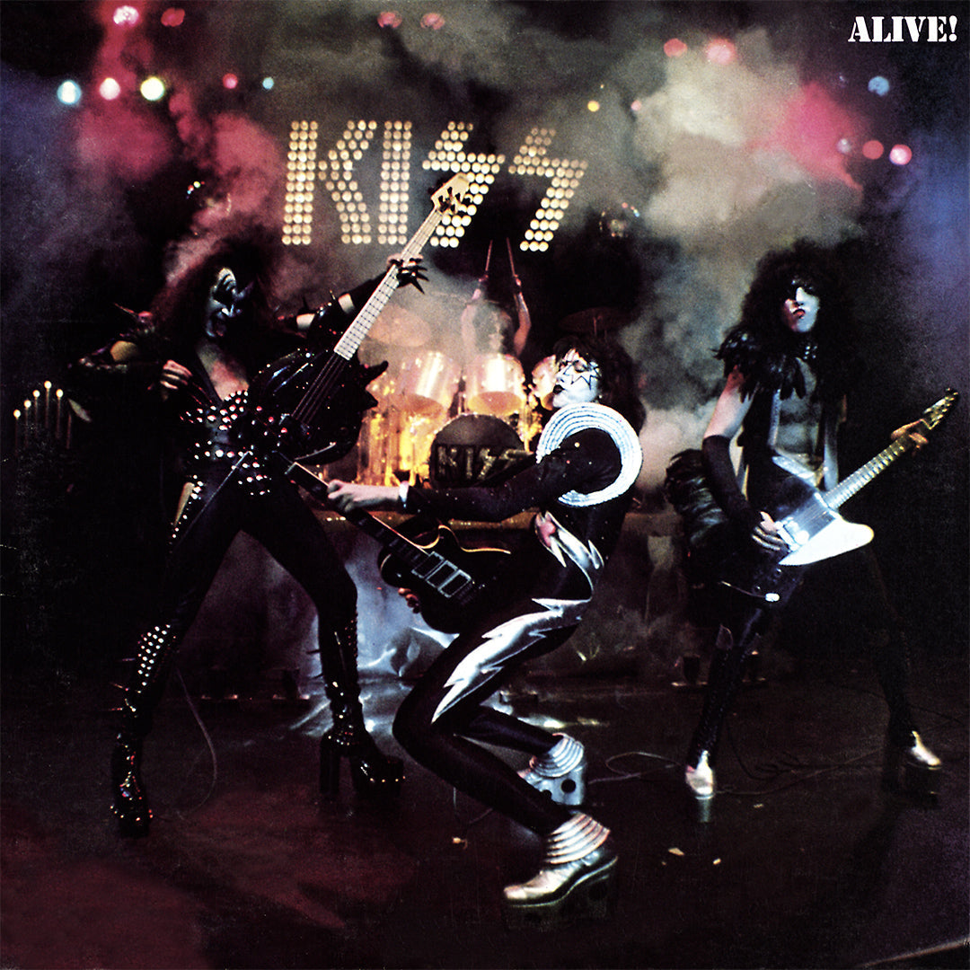 KISS Alive! album cover showing the band performing in black and silver stage costumes beneath the KISS logo.