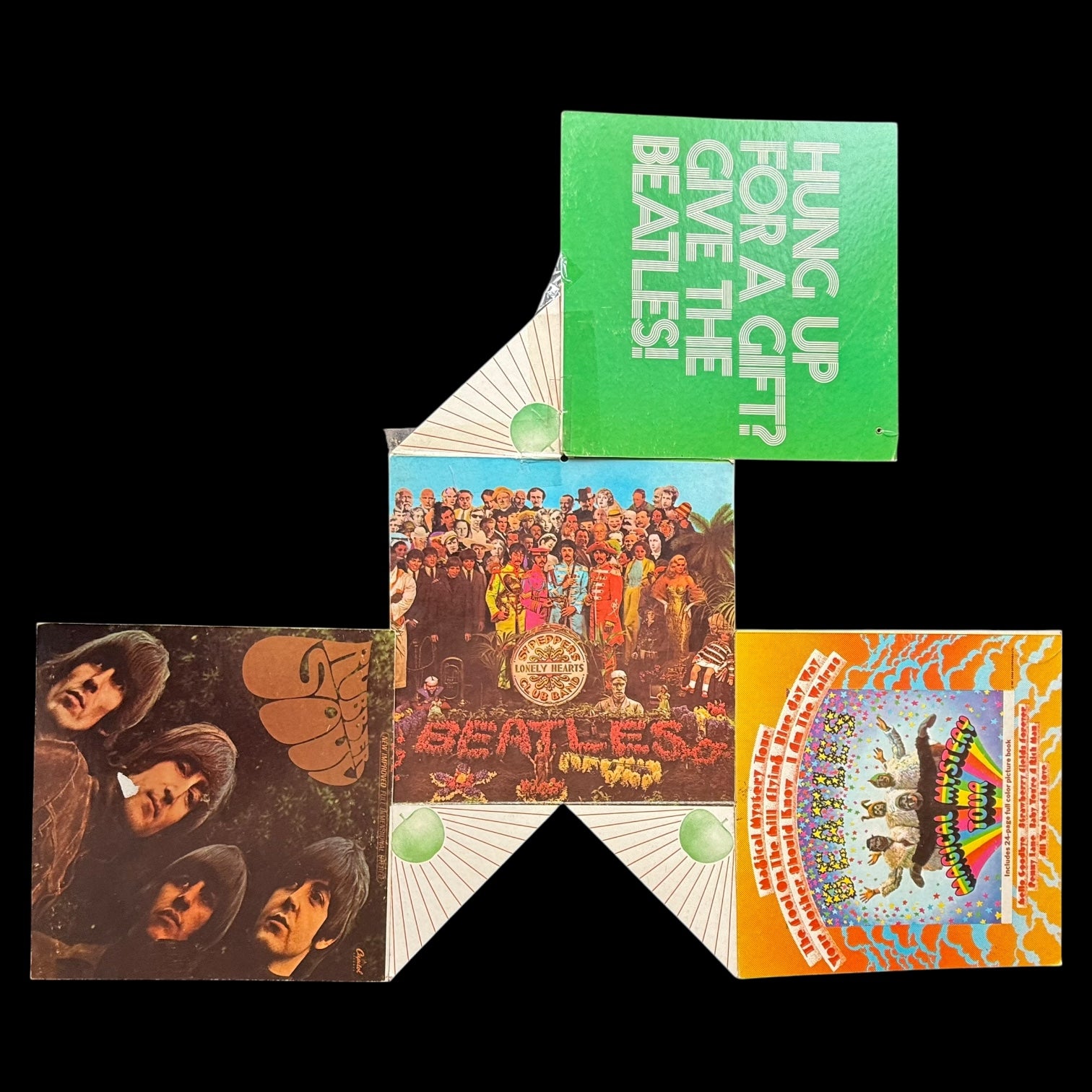 All seven panels of original 1969 Beatles Capitol Records Christmas retail mobile flat lay — Rubber Soul, Sgt Peppers, Magical Mystery Tour, White Album