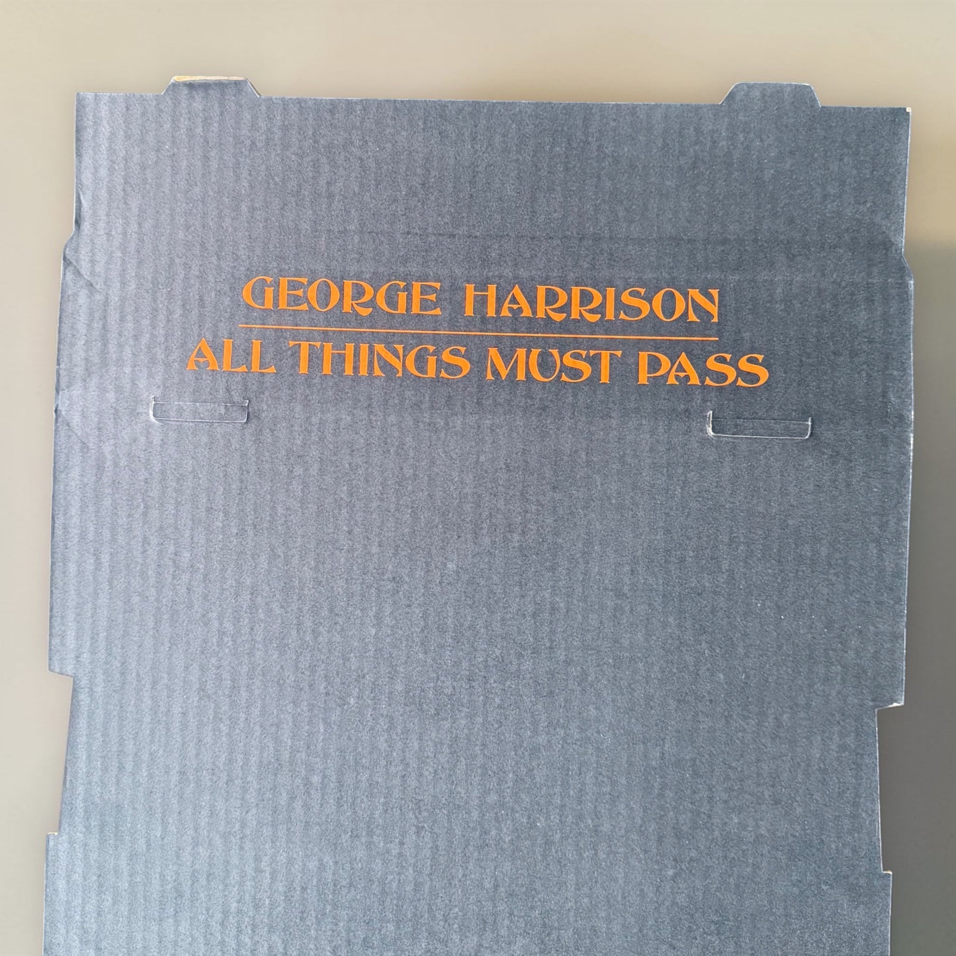 1971 George Harrison All Things Must Pass tape merchandiser display bin George Harrison All Things Must Pass orange lettering close up detail mint unassembled Apple Records 1971