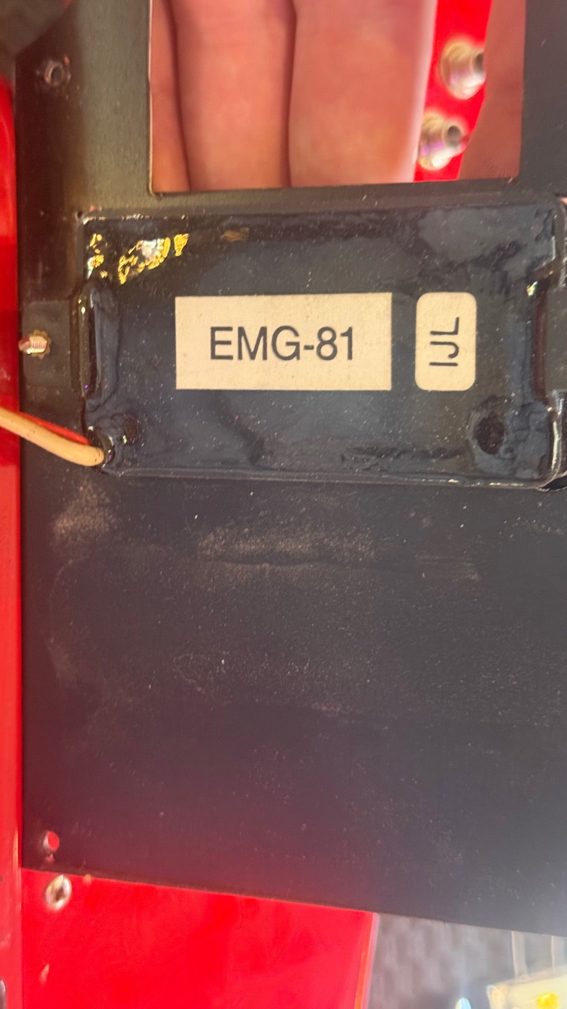 Modified Epiphone Firebird — underside of pickup showing EMG-81 model label